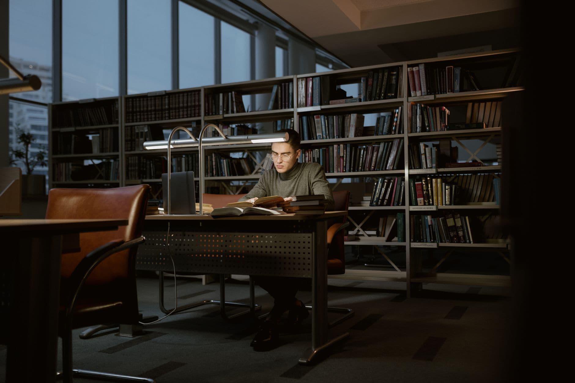 A student reading at a desk